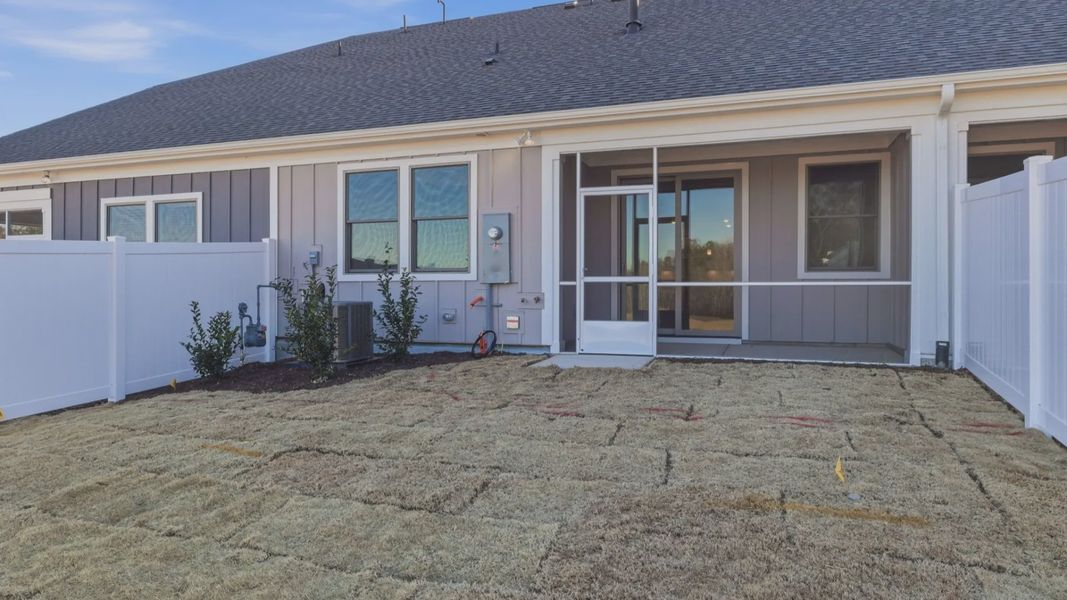 Exterior details and patio area of a home in The Courtyards at Oak Grove, Durham (Image 4).