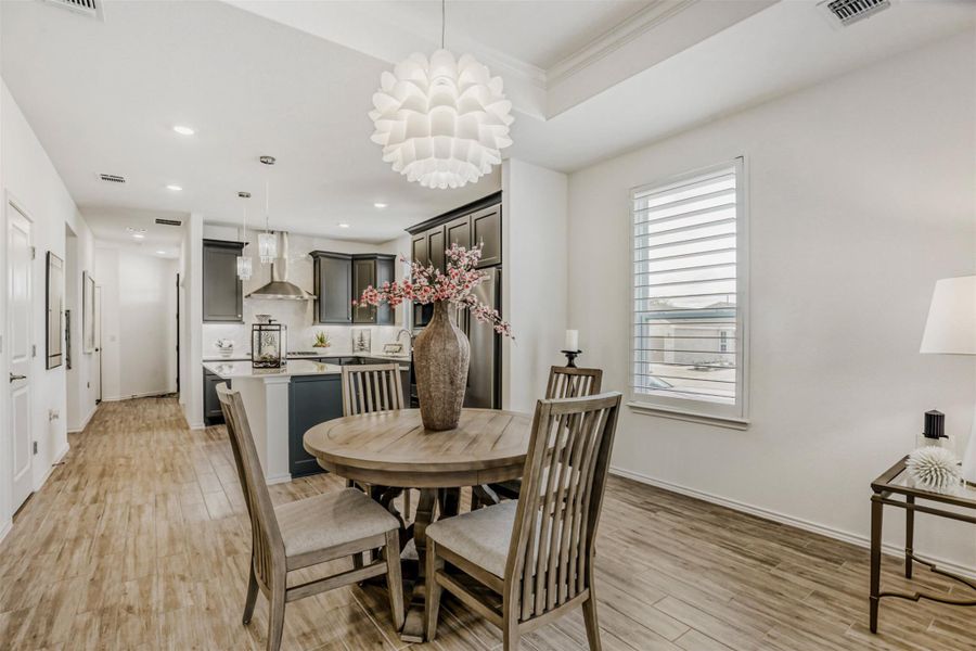 Dining space with light wood-style flooring