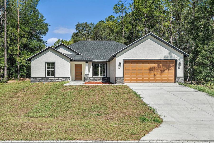 Front exterior of a new home in , Citrus Springs, FL, highlighting curb appeal (Image 14).