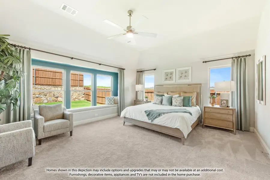 Spacious master bedroom with vaulted ceiling, ceiling fan, bay window, and carpet flooring Spacious master bedroom with vaulted ceiling, ceiling fan, bay window, and carpet flooring