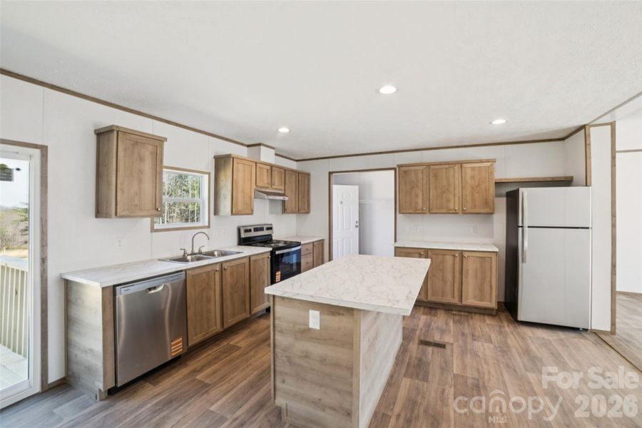 Furnished interior view inside a new home in , Vale (Image 7).