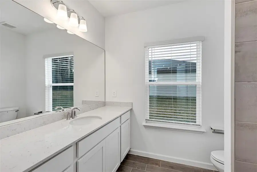 Furnished interior view inside a new home in , Dunnellon (Image 7).