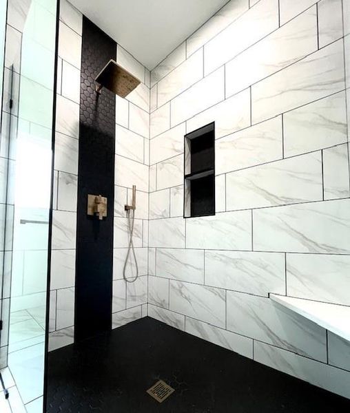 Full bathroom featuring tiled shower