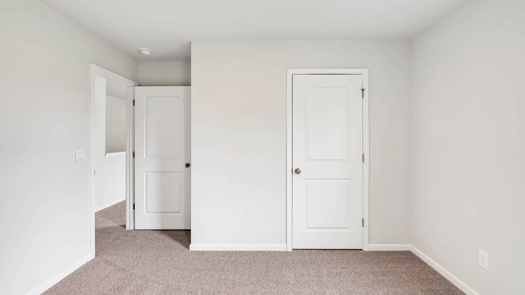 Spacious, unfurnished interior of a new home in Sidbury Station, Castle Hayne (Image 37).