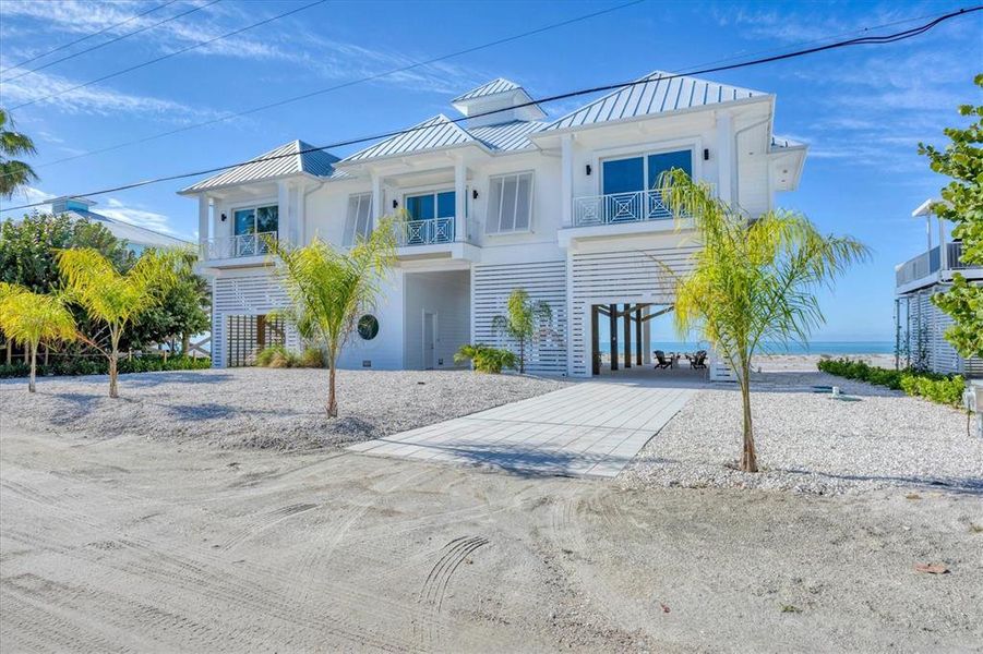 Front exterior of a new home in , Placida, FL, highlighting curb appeal (Image 22).