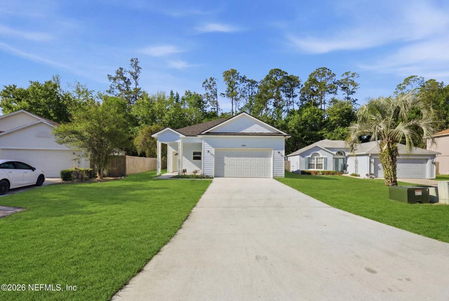 Front exterior of a new home in , Middleburg, FL, highlighting curb appeal (Image 20). Front exterior of a new home in , Middleburg, FL, highlighting curb appeal (Image 20).