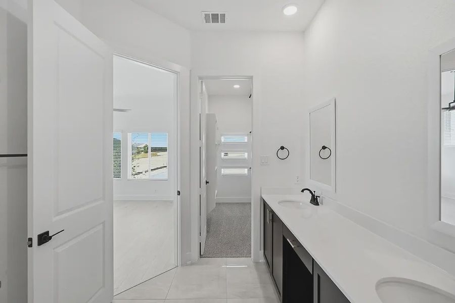 Representative furnished interior of a home built from the Athena by Chesmar Homes in Prominence Urban, San Antonio (Image 14).
