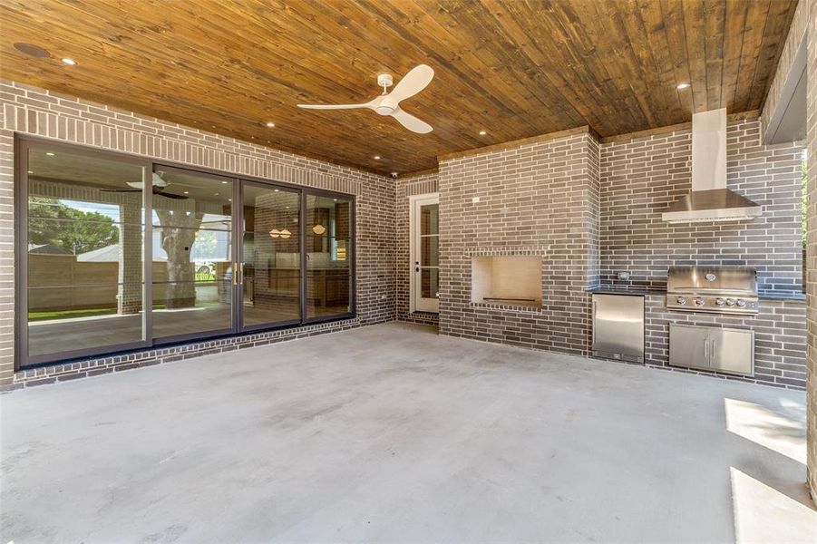 View of patio with a ceiling fan and exterior kitchen View of patio with a ceiling fan and exterior kitchen