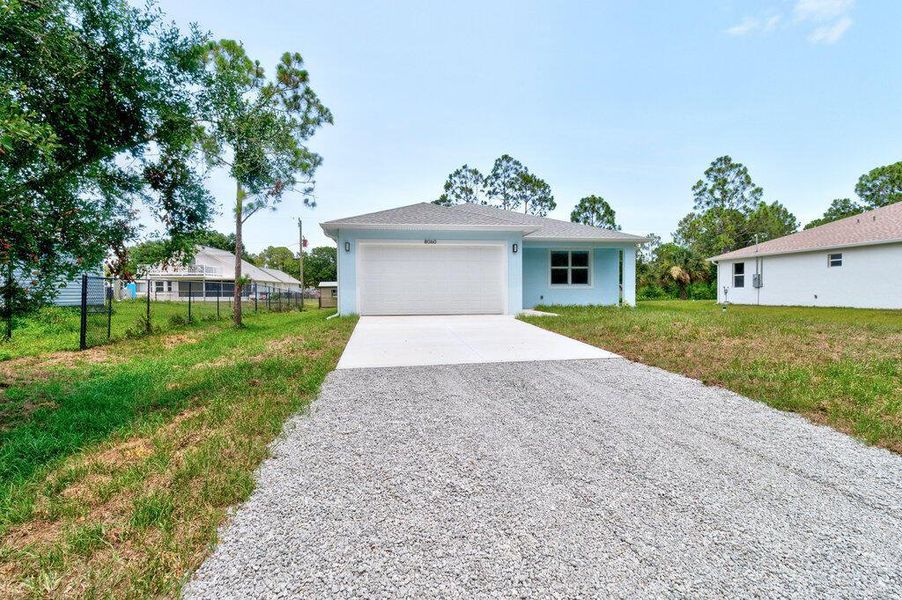 Front exterior of a new home in , Vero Beach, FL, highlighting curb appeal (Image 20). Front exterior of a new home in , Vero Beach, FL, highlighting curb appeal (Image 20).