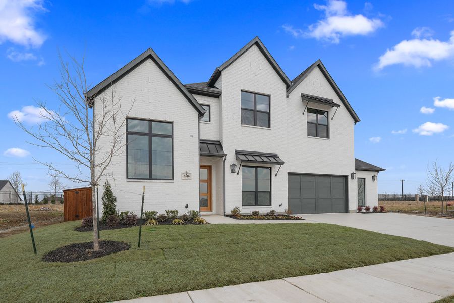 Front exterior of a new home in Park Place - 80' Lots, Prosper, TX, highlighting curb appeal (Image 26). Front exterior of a new home in Park Place - 80' Lots, Prosper, TX, highlighting curb appeal (Image 26).