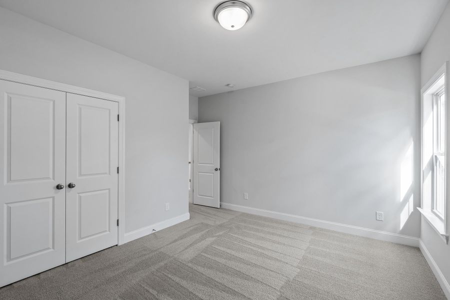 Spacious, unfurnished interior of a new home in K. Hovnanian's® Four Seasons at Lakes of Cane Bay, Summerville (Image 20).