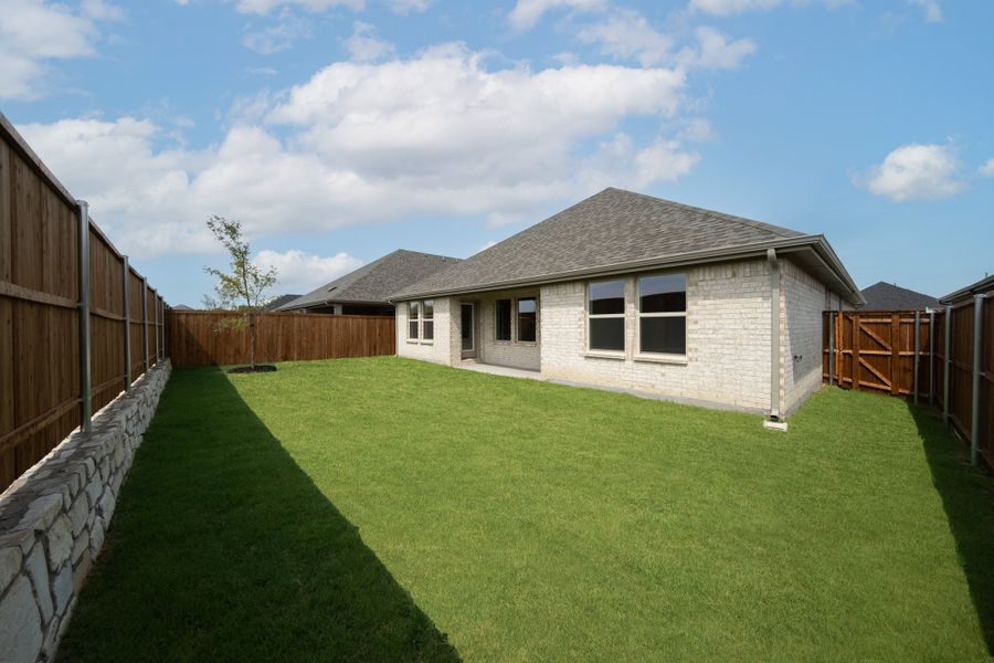 Exterior details and patio area of a home in Whitewing Trails, Princeton (Image 2).