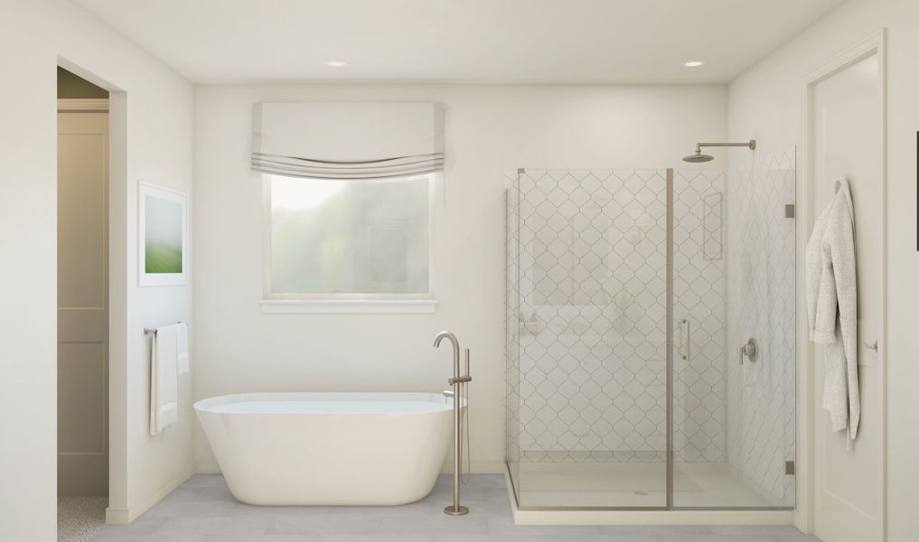 Primary bath with freestanding tub and glass shower enclosure