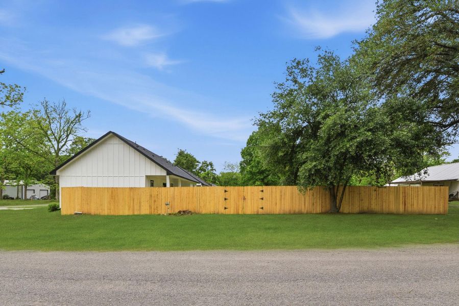 Double gate on side fence for car entrance