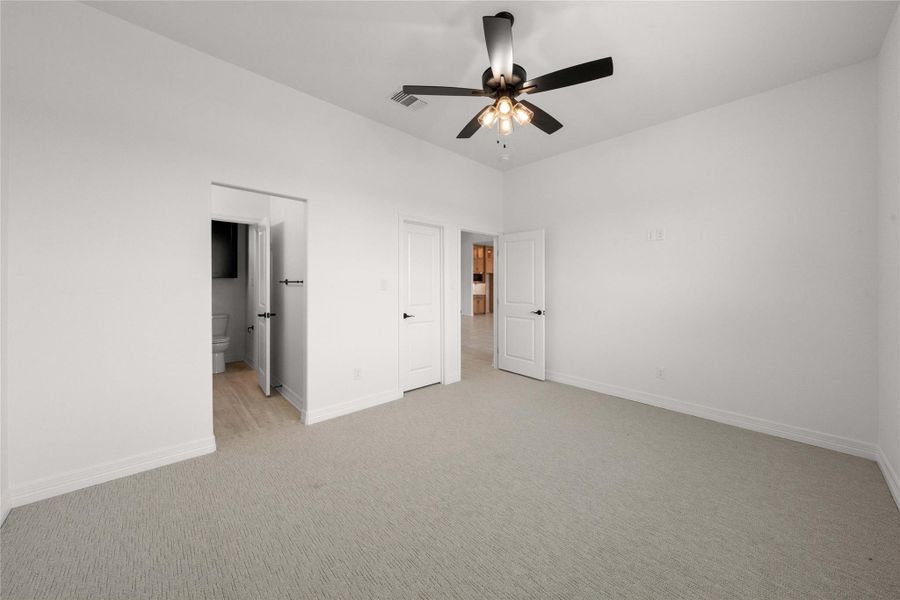 An inviting room features plush carpeting and convenient access to a private bathroom and hallway. An inviting room features plush carpeting and convenient access to a private bathroom and hallway.