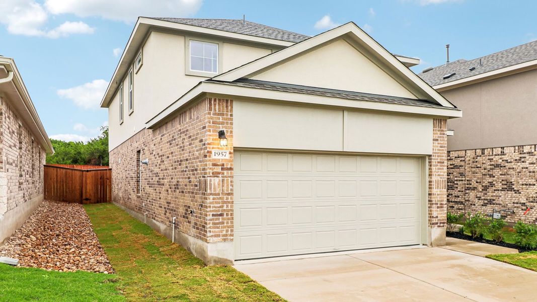 Front exterior of a new home in Bar W Ranch, Leander, TX, highlighting curb appeal (Image 18).