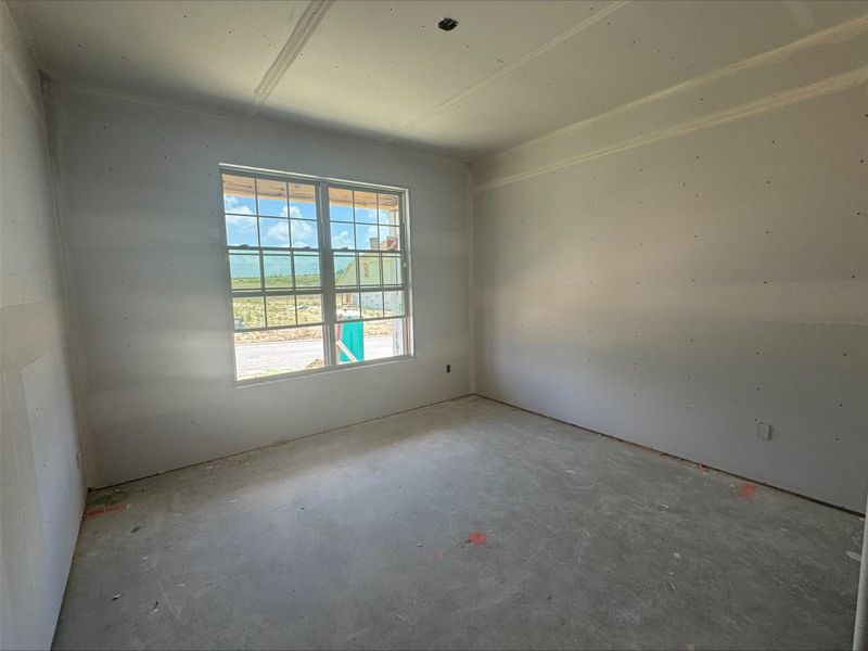 Spare room featuring concrete floors