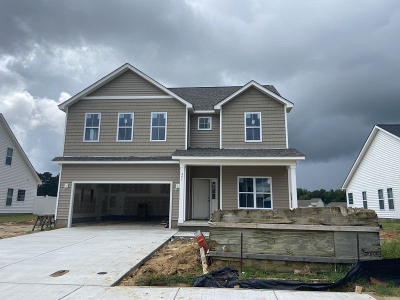 Front exterior of a new home in Arbor Hills South II, Greenville, NC, highlighting curb appeal (Image 1).
