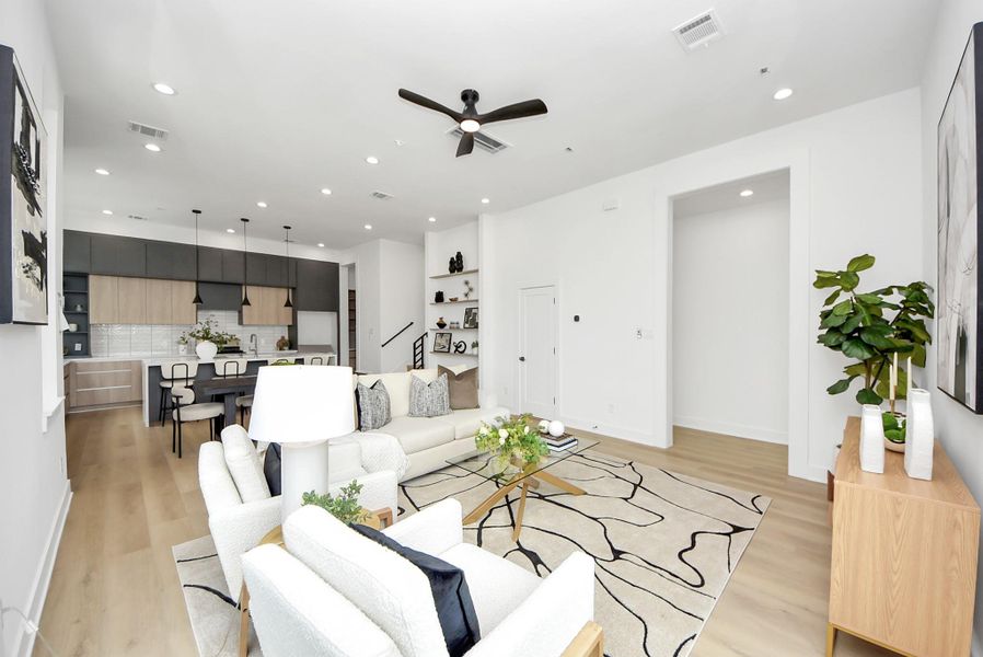 Open living space showcasing the seamless connection between the living, dining, and kitchen areas.