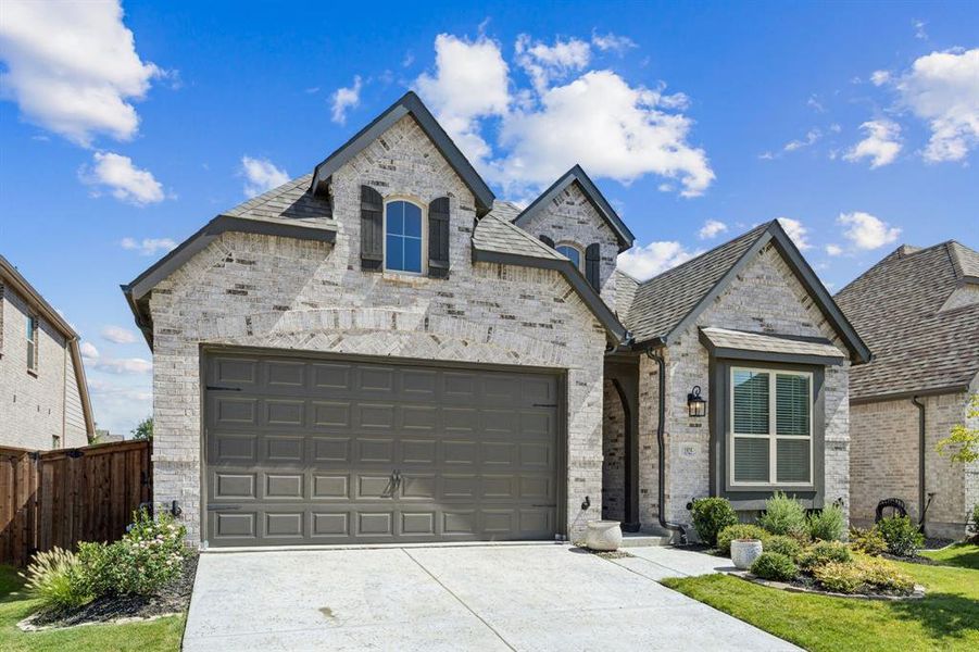 Front exterior of a new home in , Aubrey, TX, highlighting curb appeal (Image 23). Front exterior of a new home in , Aubrey, TX, highlighting curb appeal (Image 23).