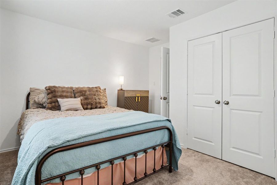 Neutral tone carpeting complements the white wall finishes