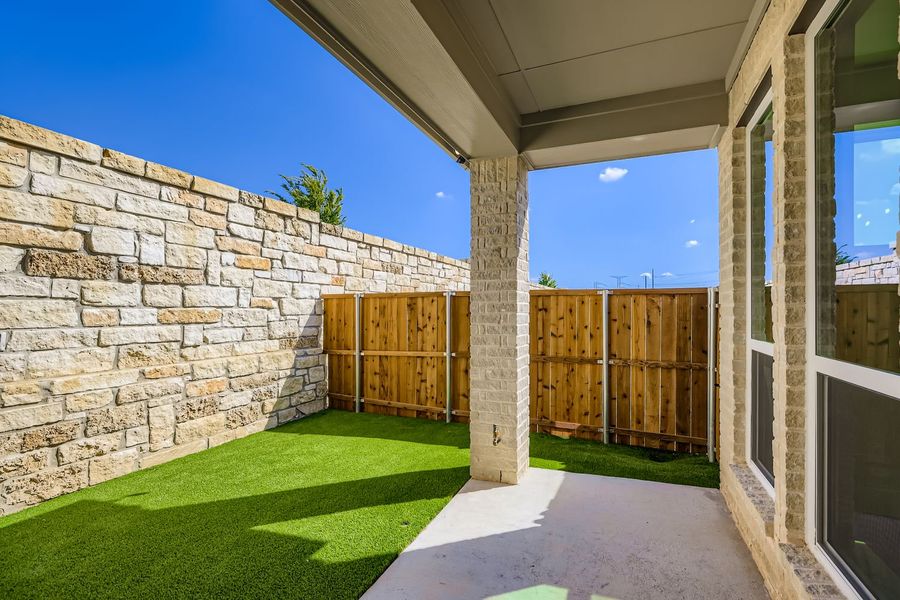 Exterior details and patio area of a home in Castle Hills Northpointe - Townhomes, Lewisville (Image 3).
