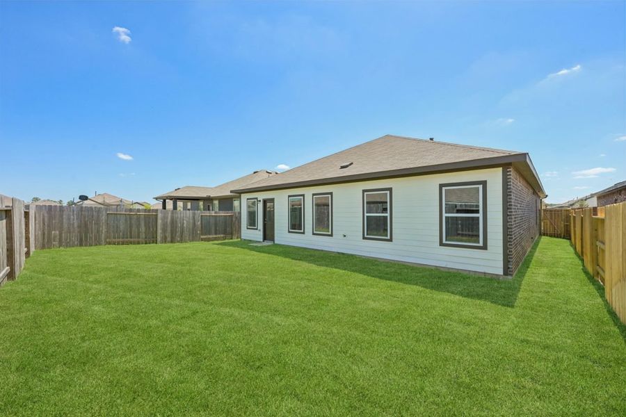 Exterior details and patio area of a home in Harrington Trails, New Caney (Image 18).