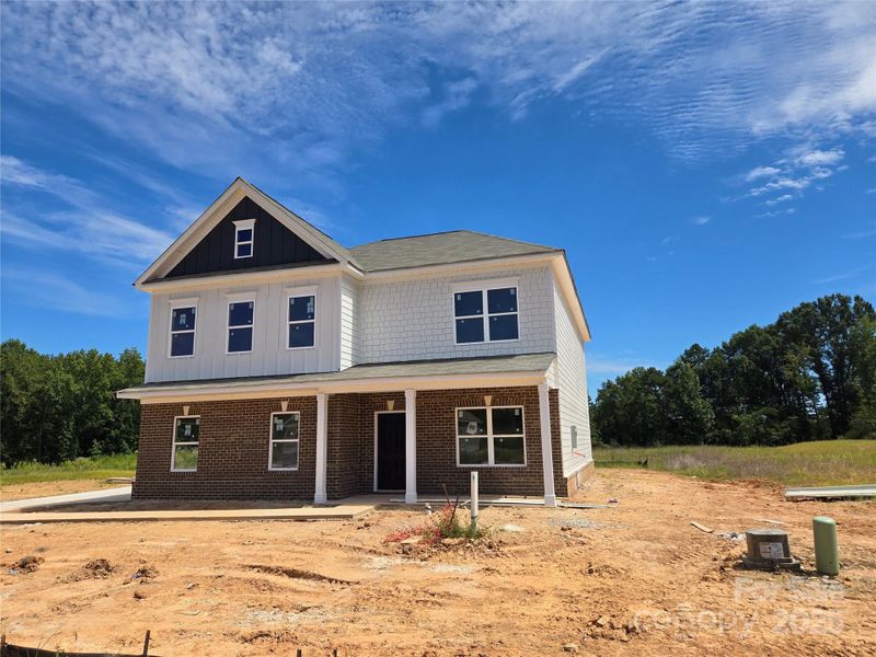 Front exterior of a new home in Cedar Meadows, Monroe, NC, highlighting curb appeal (Image 2). Front exterior of a new home in Cedar Meadows, Monroe, NC, highlighting curb appeal (Image 2).