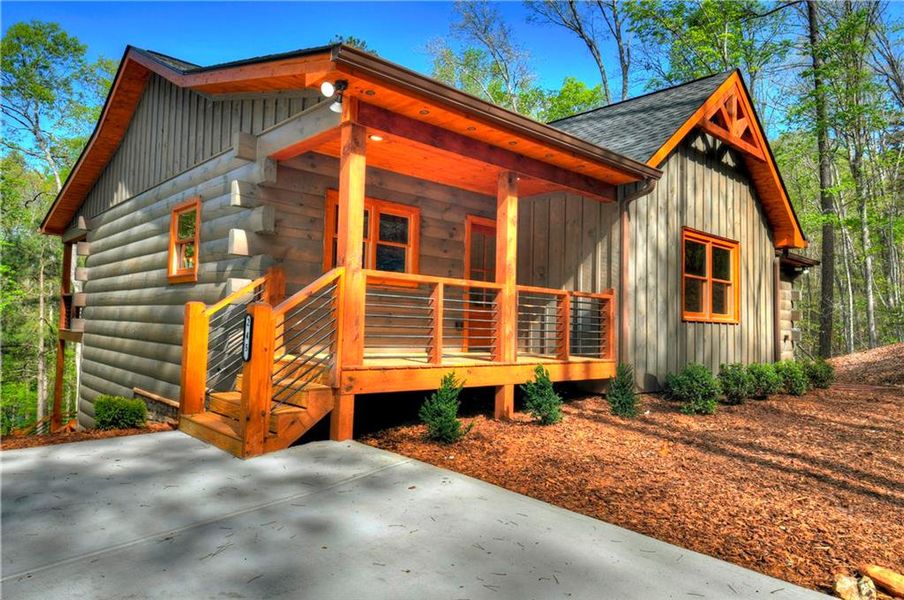Exterior details and patio area of a home in , Ellijay (Image 24).