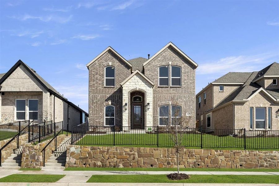 Front exterior of a new home in Trails at Cottonwood Creek, Rowlett, TX, highlighting curb appeal (Image 1). Front exterior of a new home in Trails at Cottonwood Creek, Rowlett, TX, highlighting curb appeal (Image 1).