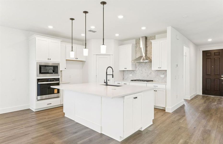 Spacious eat-in kitchen designed with a large island for dining