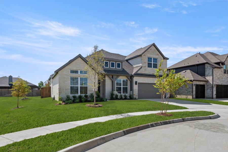 Front exterior of a new home in Panchasarp Farms, Burleson, TX, highlighting curb appeal (Image 2). Front exterior of a new home in Panchasarp Farms, Burleson, TX, highlighting curb appeal (Image 2).