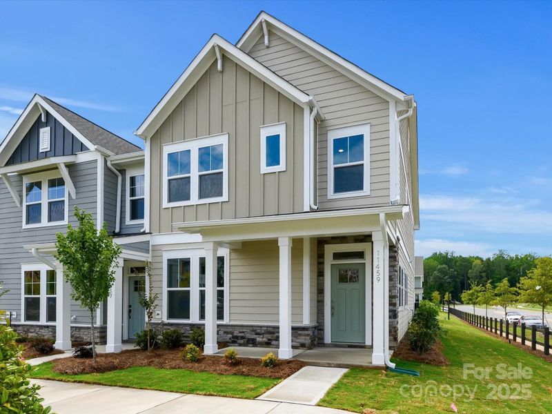 Front exterior of a new home in North Creek Village - Townhomes, Huntersville, NC, highlighting curb appeal (Image 17). Front exterior of a new home in North Creek Village - Townhomes, Huntersville, NC, highlighting curb appeal (Image 17).