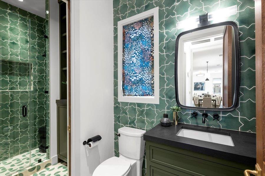 Handmade clay tile lines the walls of this sophisticated bath.