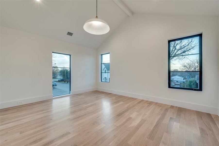 Large game room with wood flooring and huge storage closet