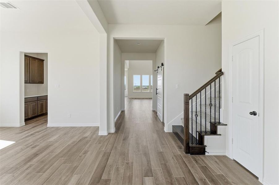 Entrance foyer with light wood-style floors and stairway Entrance foyer with light wood-style floors and stairway