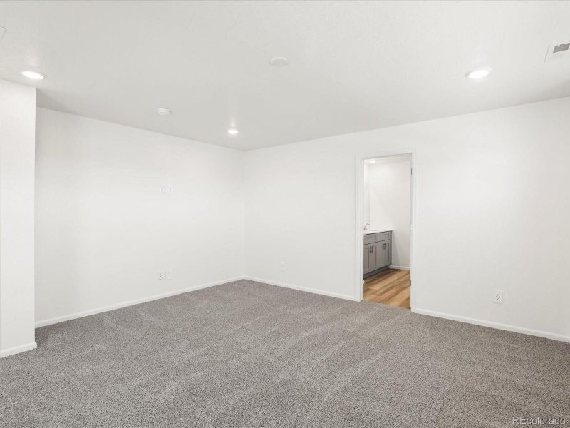 Spacious, unfurnished interior of a new home in Ridgeline Vista: The Flora Collection, Brighton (Image 29).