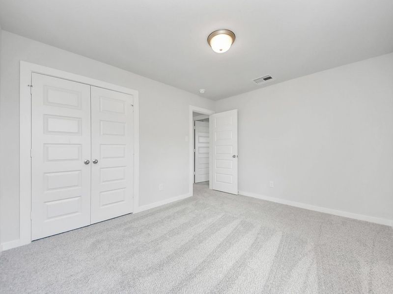 Spacious, unfurnished interior of a new home in Sunterra, Katy (Image 31).