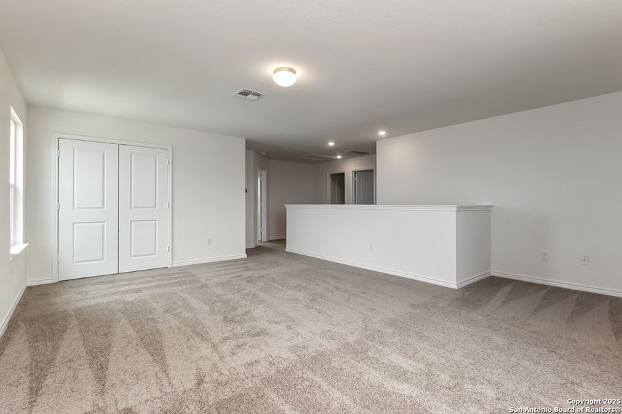 Spacious, unfurnished interior of a new home in Hidden Bluffs at TRP, San Antonio (Image 7).