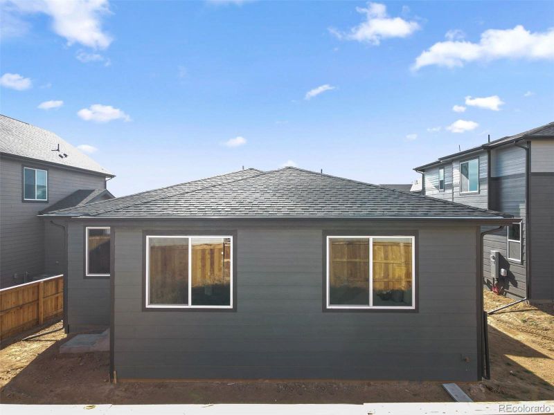 Exterior details and patio area of a home in The Cottages Collection at Ridgeline Vista, Brighton (Image 3).