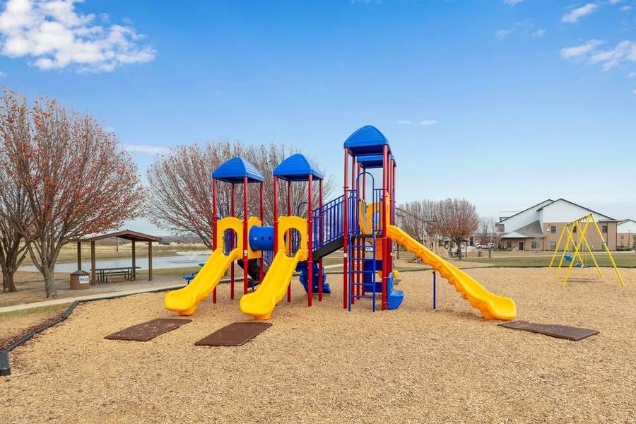 Communal playground with a water view, a gazebo, and a patio Communal playground with a water view, a gazebo, and a patio