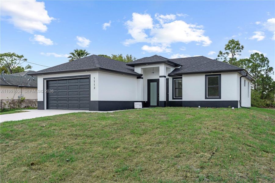 Front exterior of a new home in , Lehigh Acres, FL, highlighting curb appeal (Image 1). Front exterior of a new home in , Lehigh Acres, FL, highlighting curb appeal (Image 1).