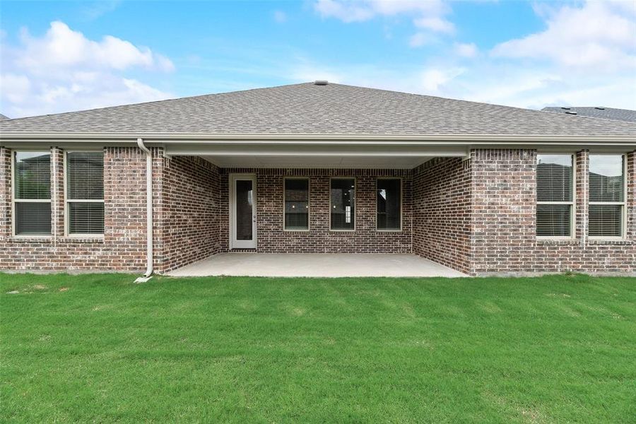 Front exterior of a new home in Sutton Fields, Celina, TX, highlighting curb appeal (Image 16).