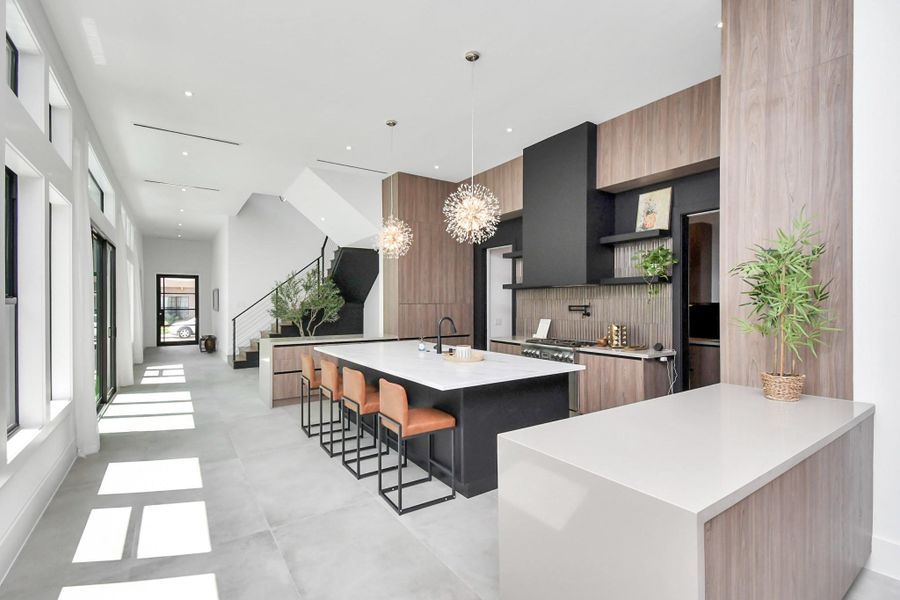Ample counter space and cabinets on both sides of the main kitchen area.