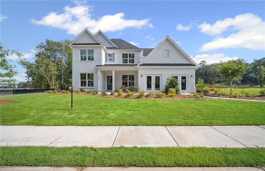 Front exterior of a new home in Rose Creek, Cumming, GA, highlighting curb appeal (Image 2). Front exterior of a new home in Rose Creek, Cumming, GA, highlighting curb appeal (Image 2).