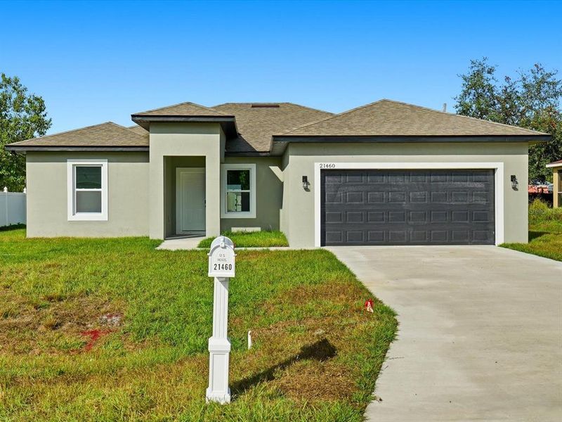 Front exterior of a new home in , Port Charlotte, FL, highlighting curb appeal (Image 26). Front exterior of a new home in , Port Charlotte, FL, highlighting curb appeal (Image 26).