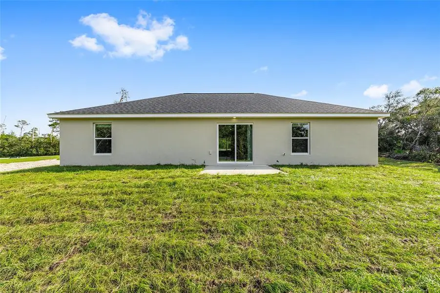 Exterior details and patio area of a home in , Ocala (Image 4).