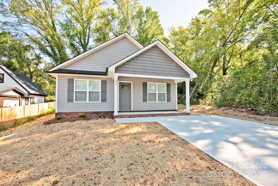 Front exterior of a new home in , Concord, NC, highlighting curb appeal (Image 1). Front exterior of a new home in , Concord, NC, highlighting curb appeal (Image 1).