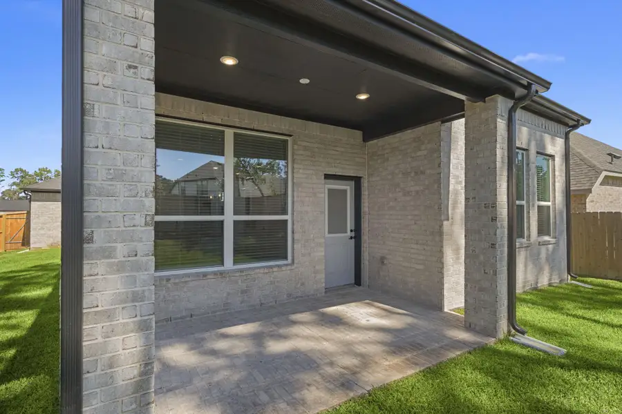 Exterior details and patio area of a home in The Woodlands Hills, Willis (Image 3). Exterior details and patio area of a home in The Woodlands Hills, Willis (Image 3).