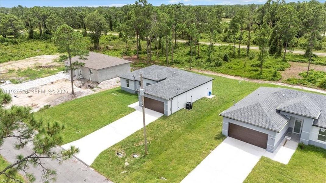 Front exterior of a new home in , Lehigh Acres, FL, highlighting curb appeal (Image 22).